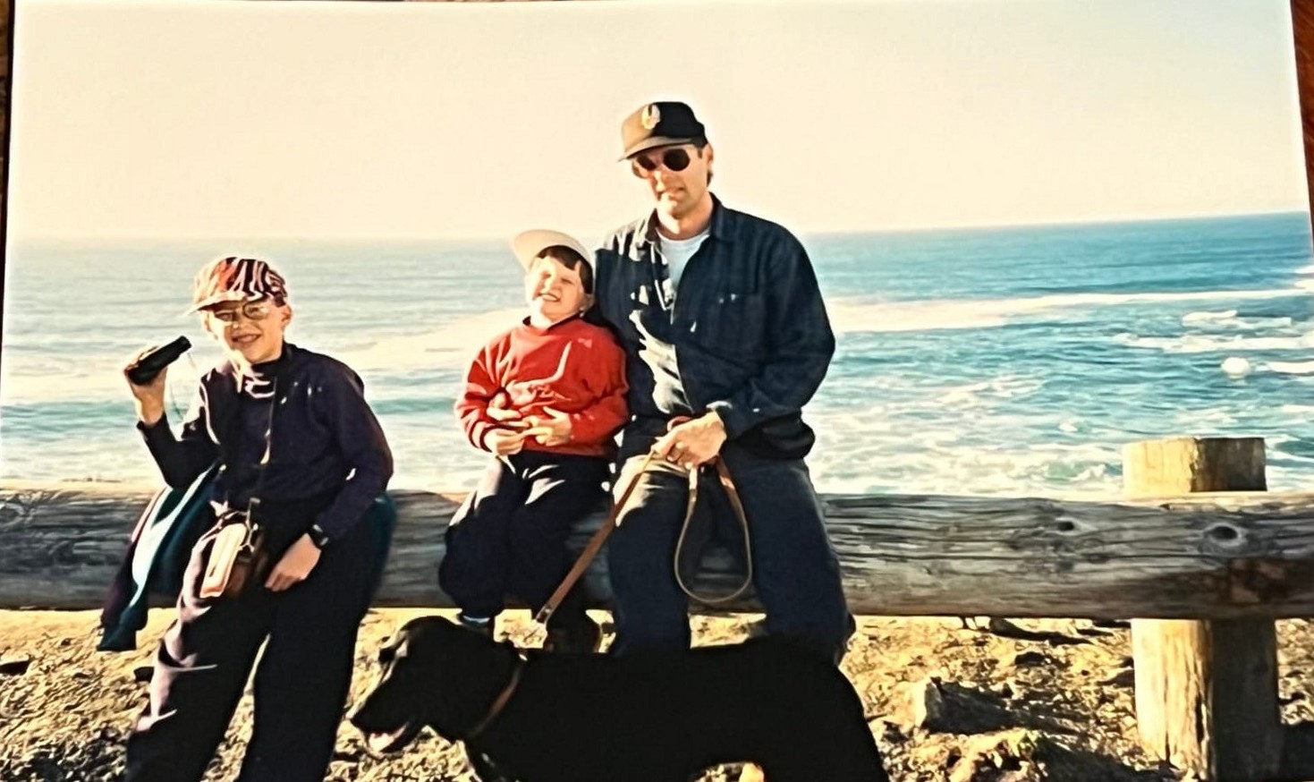 The Byars family bundled up on a windy coastal beach
