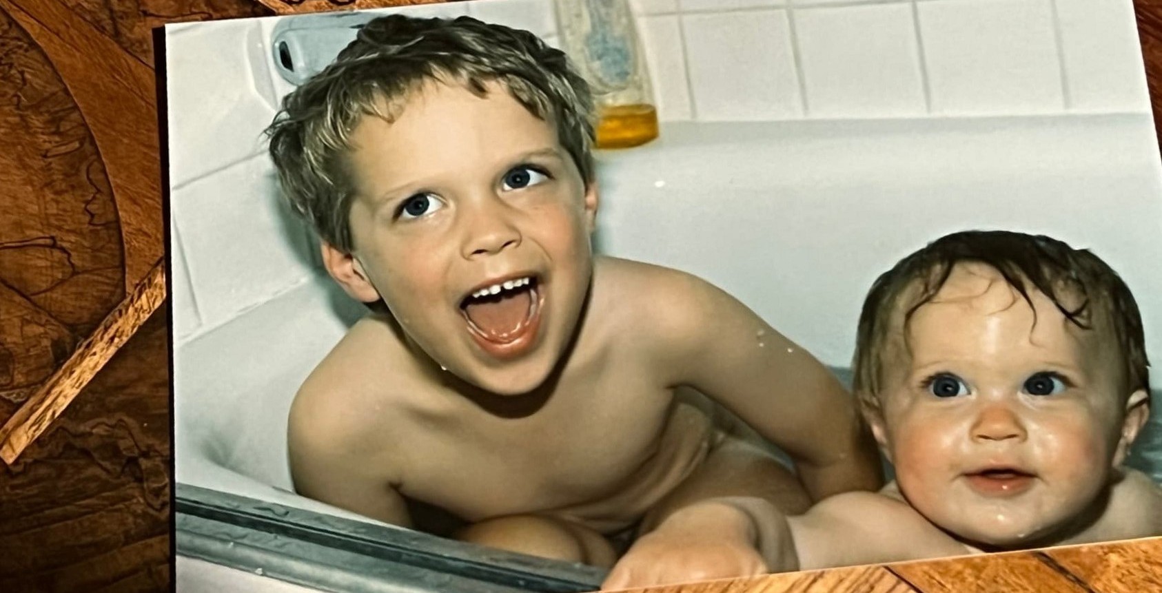 The Byars brothers as toddlers laughing together in the bathtub